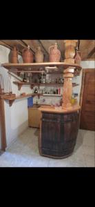 a kitchen with baskets on top of a barrel at Kuća za zabavu ili odmor-Pegas in Orehovica