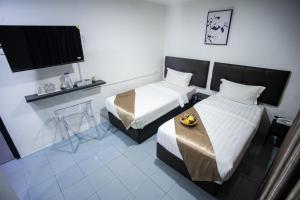 Postel nebo postele na pokoji v ubytování Rex City Hotel