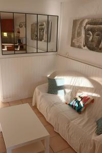 a small room with a bed and a table at Maison de village sur Donzère in Donzère