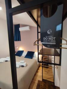 Postel nebo postele na pokoji v ubytování Guest House alla Scala