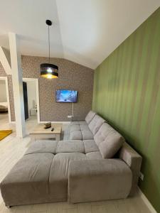 TV a/nebo společenská místnost v ubytování Residence 8 de Luxe!