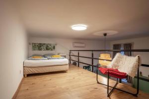 A bed or beds in a room at Cosy Studio In Terezvaros W41 Green
