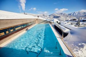 a swimming pool in the snow on a boat at Hotel Bussi Baby in Bad Wiessee