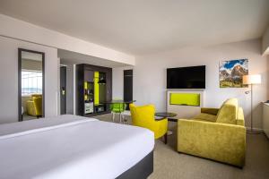 TV a/nebo společenská místnost v ubytování Thon Hotel Brussels City Centre