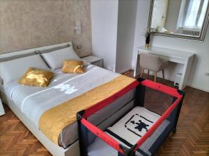 a bedroom with a large bed with a desk at La Casita in Castelfidardo