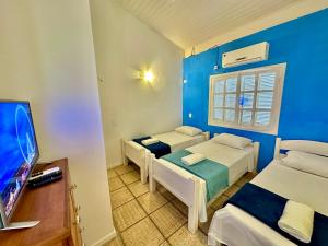 TV a/nebo společenská místnost v ubytování Pousada Pantai Maresias