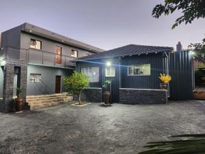 a house with a black at The Throne Goc Guesthouse in Johannesburg