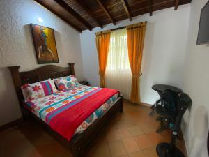 Postel nebo postele na pokoji v ubytování RANCHO SAN LUIS, Páramo