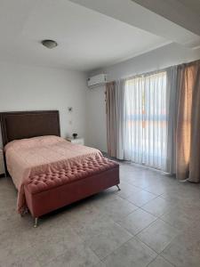 Ένα ή περισσότερα κρεβάτια σε δωμάτιο στο Duplex con pileta +19 φωτογραφίες