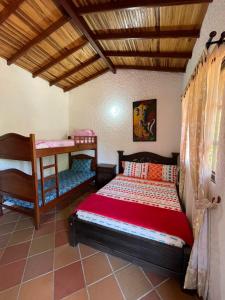 Postel nebo postele na pokoji v ubytování RANCHO SAN LUIS, Páramo