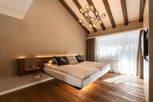 Postel nebo postele na pokoji v ubytování Elfi - luxury mountain bijou by Inspiringplaces Zermatt