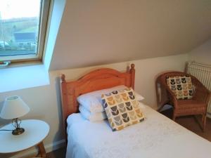 Postel nebo postele na pokoji v ubytování Old Dairy Cottage