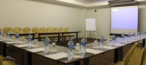a room with a bunch of bottles of water on a table at Şehri Saray Otel in Seyhan