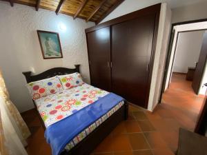 Postel nebo postele na pokoji v ubytování RANCHO SAN LUIS, Páramo