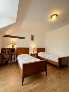 Postel nebo postele na pokoji v ubytování Hotel Lony