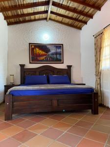 Postel nebo postele na pokoji v ubytování RANCHO SAN LUIS, Páramo