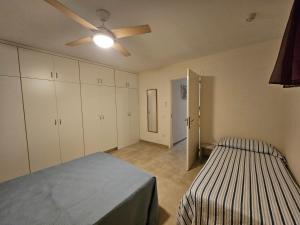 A bed or beds in a room at Perfect Getaway in Los Gigantes, Shared Pool-WiFi Még 32 kép