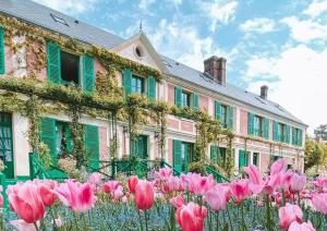 a bunch of pink tulips in front of a building at Splendide studio de Giverny Vernon Paris in Vernon +6 photos
