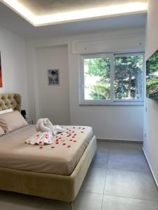 Una cama o camas en una habitación de SANGIOVANNI rooms