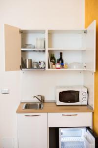Kuchyň nebo kuchyňský kout v ubytování Rooms Boutique Carducci