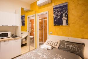 Postel nebo postele na pokoji v ubytování Rooms Boutique Carducci