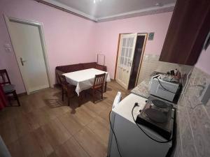 A kitchen or kitchenette at Abigél Apartman
