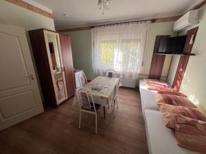 A television and/or entertainment centre at Abigél Apartman