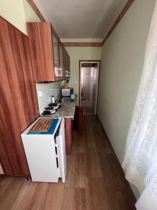 A kitchen or kitchenette at Abigél Apartman