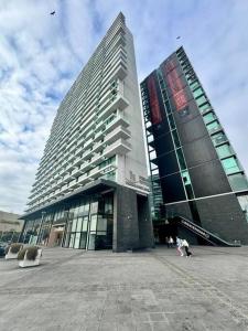 a large building with a person in front of it at PRO HOME Balmaceda III in Antofagasta +3 photos