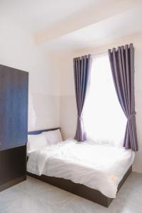 Postel nebo postele na pokoji v ubytování Hotel Leonda-gần chợ đêm-near the night market