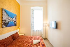 Postel nebo postele na pokoji v ubytování Rooms Boutique Carducci