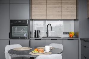 Η κουζίνα ή μικρή κουζίνα στο Apartament na Herbu Oksza 18