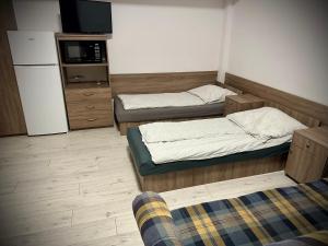 Łóżko lub łóżka w pokoju w obiekcie Hostel Sportowa