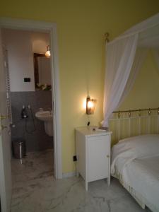 Łóżko lub łóżka w pokoju w obiekcie Villa Murgese