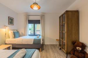 Ένα ή περισσότερα κρεβάτια σε δωμάτιο στο Maison 3 chambres avec jardin & parking, prox tram