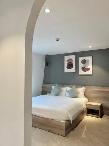 Giường trong phòng chung tại La Sera Suites Nha Trang