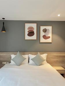Giường trong phòng chung tại La Sera Suites Nha Trang