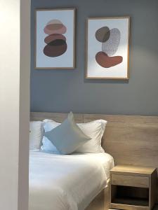 Giường trong phòng chung tại La Sera Suites Nha Trang