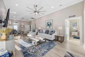 a living room with a white couch and a table at Channel Catch in Myrtle Beach