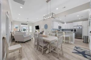 a kitchen and living room with a table and chairs at Channel Catch in Myrtle Beach
