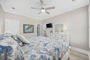 a bedroom with a bed and a ceiling fan at Channel Catch in Myrtle Beach