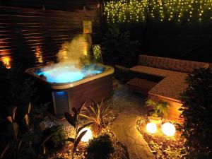 a hot tub in the middle of a patio at night at Bisanthe Panorama in Kumbağ
