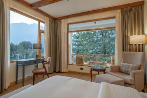 Postel nebo postele na pokoji v ubytování The Panorama Retreat, Manali