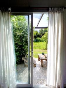 an open sliding glass door with a view of a patio at Loft en Los Acantilados in Mar del Plata +9 photos