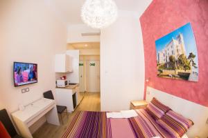 TV a/nebo společenská místnost v ubytování Rooms Boutique Carducci