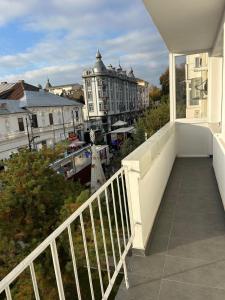 a balcony with a view of a city at Azure Apartment in Craiova