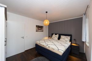 Postel nebo postele na pokoji v ubytování Fuldaer Residenz