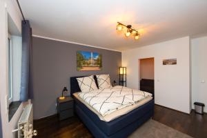 Postel nebo postele na pokoji v ubytování Fuldaer Residenz