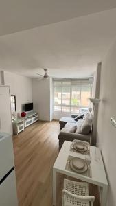 a living room with a couch and a table at Estudio Pastora in Torremolinos