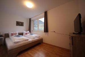 Postel nebo postele na pokoji v ubytování Monika-Mellau Appartements